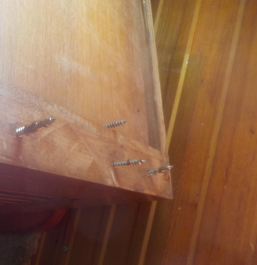2657Screws pulled out of salon table.jpeg