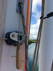 Fishing the halyard through the exit plate.jpeg