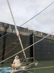 Pedro Miguel lock line handler on top of wall.jpeg