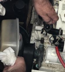 Unblocking hose on water cooler for Gen Set.jpeg
